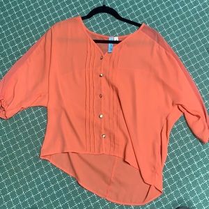 Orange three quarter length sheer blouse